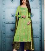 Green silk semi stitched party pant straight cut suit
