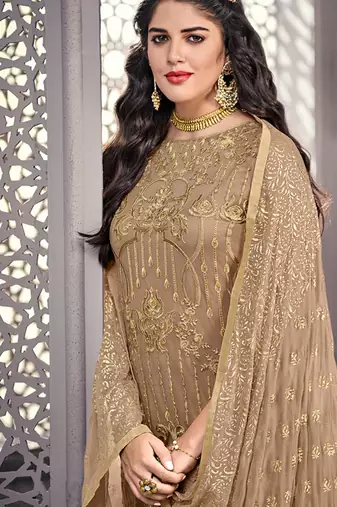 Beige net semi stitched wedding pant suit