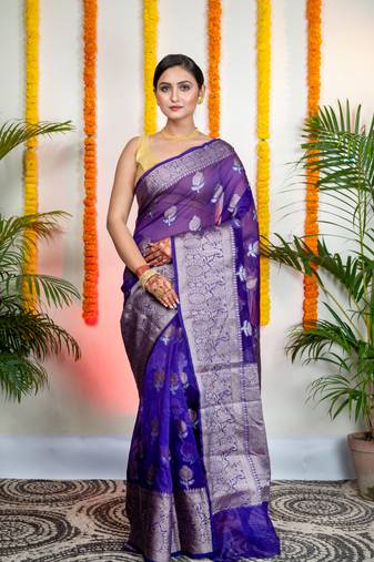 Ink blue organza silk saree with zari border and floral motifs