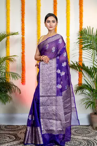 Ink blue organza silk saree with zari border and floral motifs