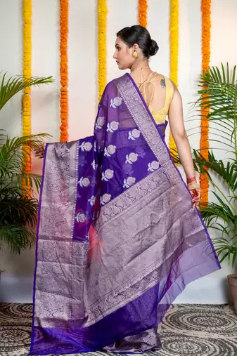 Ink blue organza silk saree with zari border and floral motifs