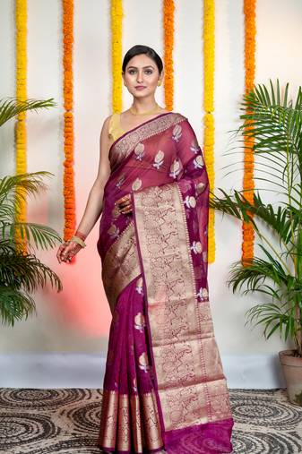 Magenta organza silk saree with zari border and floral motifs