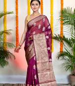 Magenta organza silk saree with zari border and floral motifs
