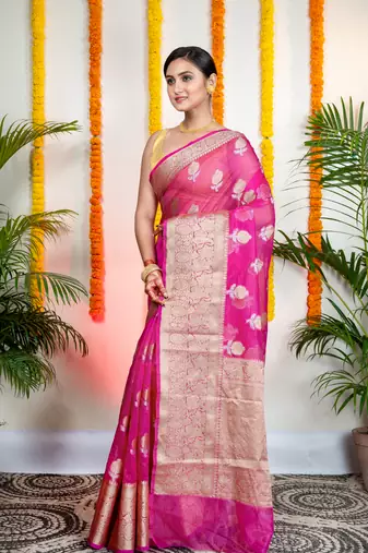 Pink organza silk saree with zari border and floral motifs