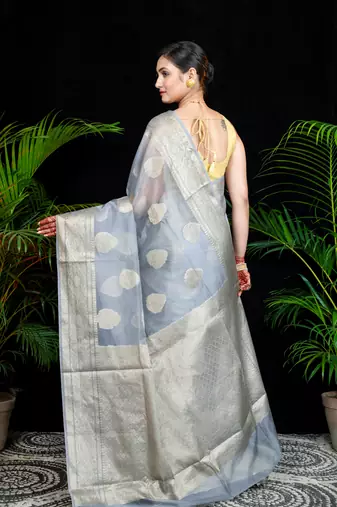 Grey organza silk saree with zari border and leaf motifs
