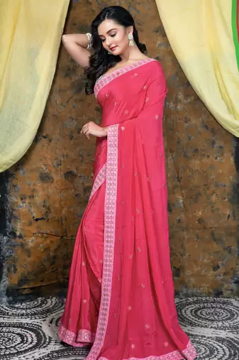 Pink embroidered crepe saree with embroidered lace border