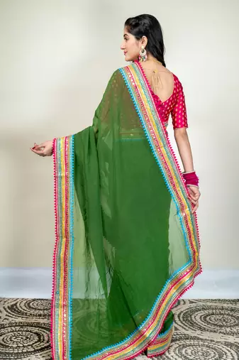 Moss green organza saree with multicolor border
