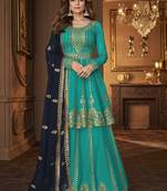 Turquoise and blue embroidered peplum top and lehenga