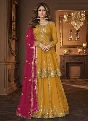 Yellow and Pink embroidered peplum top and lehenga 1