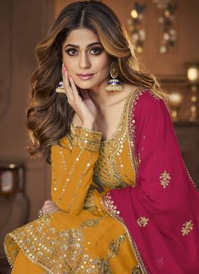 Yellow and Pink embroidered peplum top and lehenga 2
