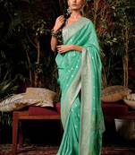 Sea green colour viscose dola silk zari woven saree with blouse