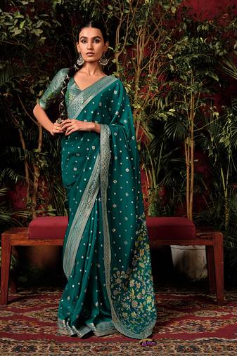 Teal green colour viscose dola silk zari woven saree with blouse