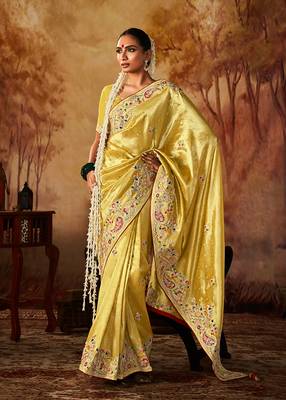 Yellow colour Faux kanjivaram banarasi silk woven saree with blouse 1