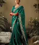 Dark green colour tissue silk embroidered saree with blouse