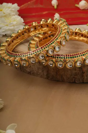 Traditional Yellow Gold Kundan Bangles with Green and White Accents