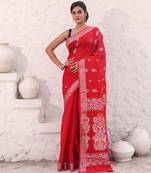 Red cotton saree with woven designs and zari border