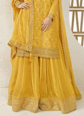 Chinnon jacquard yellow zari embroideyellow palazzo suit 2