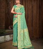Sangam prints rama green stain silk woven work traditional tassels saree