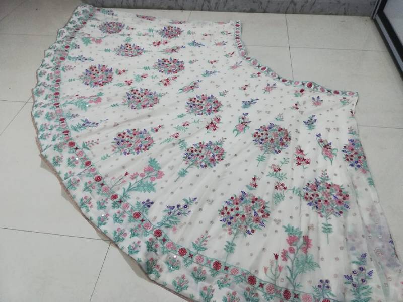 Cream Georgette Thread Embroidered Sleeveless Lehenga Choli With Net Dupatta