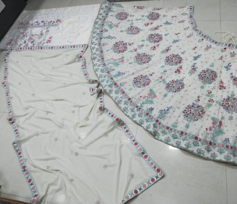 Cream Georgette Thread Embroidered Sleeveless Lehenga Choli With Net Dupatta