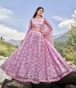 LAVENDER PINK SEQUINS AND THREAD EMBROIDERED SOFT NET FESTIVE & PARTY WEAR SEMI STITCHED LEHENGA