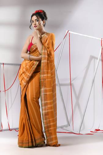 Rust cotton saree with stripes design and zari border