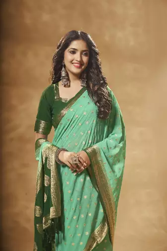 green georgette saree with heavy designer pallu