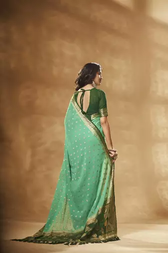 green georgette saree with heavy designer pallu