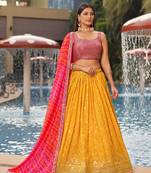YELLOW PINK SEQUINS THREAD & ZARI EMBROIDERED GEORGETTE DESIGNER WEDDING & PARTY WEAR FESTIVAL SEMI STITCHED LEHENGA