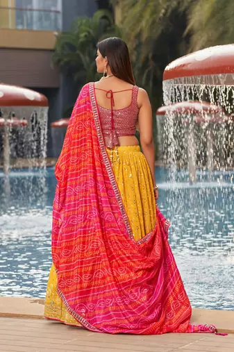 YELLOW PINK SEQUINS THREAD & ZARI EMBROIDERED GEORGETTE DESIGNER WEDDING & PARTY WEAR FESTIVAL SEMI STITCHED LEHENGA