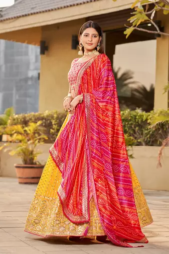 YELLOW PINK SEQUINS THREAD & ZARI EMBROIDERED GEORGETTE DESIGNER WEDDING & PARTY WEAR FESTIVAL SEMI STITCHED LEHENGA