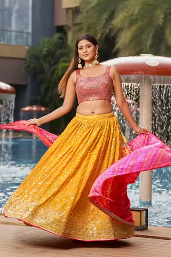 YELLOW PINK SEQUINS THREAD & ZARI EMBROIDERED GEORGETTE DESIGNER WEDDING & PARTY WEAR FESTIVAL SEMI STITCHED LEHENGA