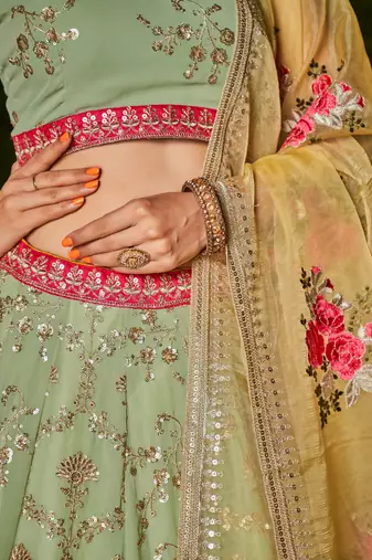 PISTA YELLOW SEQUINS THREAD & ZARI EMBROIDERED GEORGETTE DESIGNER WEDDING & PARTY WEAR FESTIVAL SEMI STITCHED LEHENGA