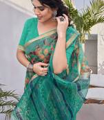 Teal kota doria/polyester leaf print/floral print golden zari border saree with unstitched blouse piece