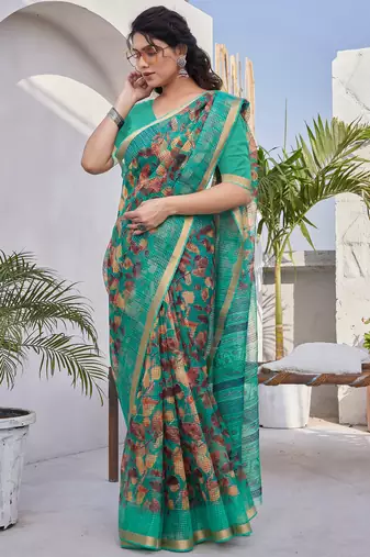 Teal kota doria/polyester leaf print/floral print golden zari border saree with unstitched blouse piece