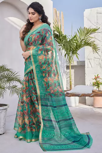 Teal kota doria/polyester leaf print/floral print golden zari border saree with unstitched blouse piece
