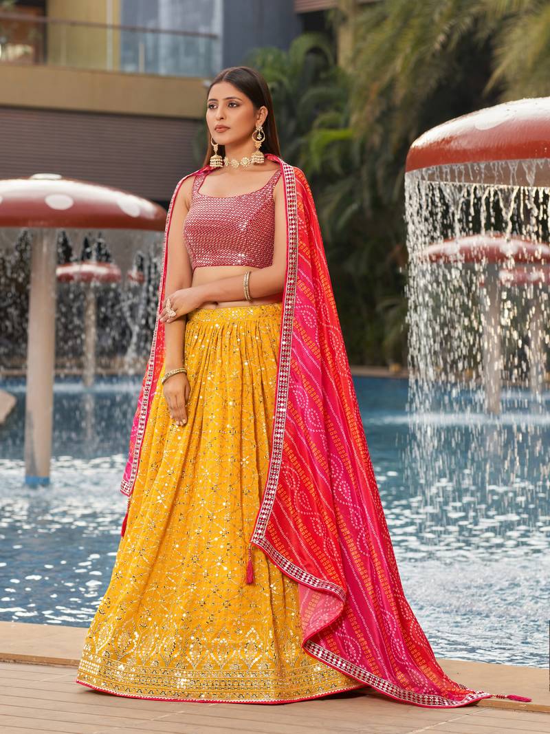 YELLOW PINK SEQUINS THREAD & ZARI EMBROIDERED GEORGETTE DESIGNER WEDDING & PARTY WEAR FESTIVAL SEMI STITCHED LEHENGA