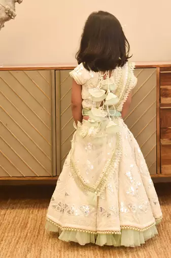 Off white thread and gota embroidery lehenga choli with green frll