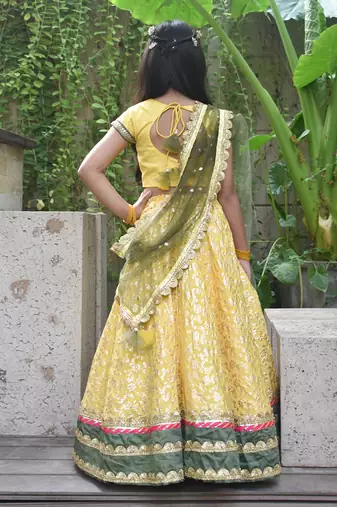 Yellow boti choli with lehenga and dupatta