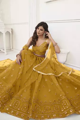 MUSTARD YELLOW NET FABRIC LEHENGA CHOLI WITH SEQUINS AND THREAD EMBROIDERY WORK