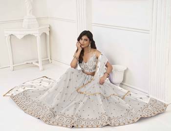 OFF WHITE NET FABRIC LEHENGA CHOLI WITH SEQUINS AND THREAD EMBROIDERY WORK 3