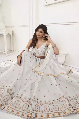 OFF WHITE NET FABRIC LEHENGA CHOLI WITH SEQUINS AND THREAD EMBROIDERY WORK