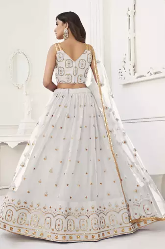 OFF WHITE NET FABRIC LEHENGA CHOLI WITH SEQUINS AND THREAD EMBROIDERY WORK