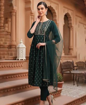 women green silk blend solid woven design flared empire kurta pant with dupatta 1