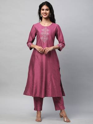 A flared kurta with machine embroidery placement of self light tone. 1