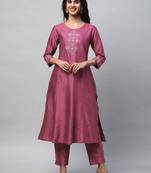 A flared kurta with machine embroidery placement of self light tone.