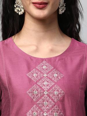A flared kurta with machine embroidery placement of self light tone. 5