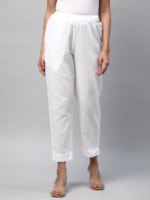 A fully elasticated white ankle length cotton linen pant. 1