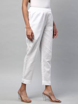 A fully elasticated white ankle length cotton linen pant. 4