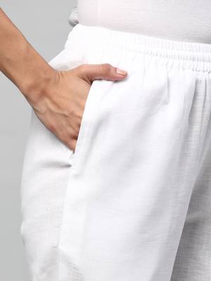 A fully elasticated white ankle length cotton linen pant. 5